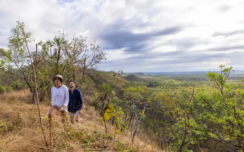 Two people hiking through Silkwood woodlands