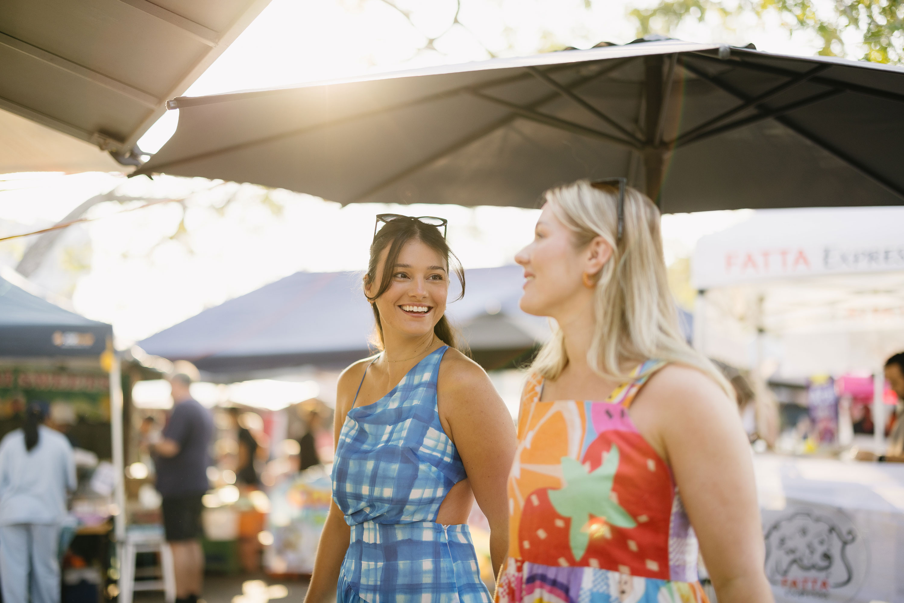 Visitors exploring a local outdoor market.