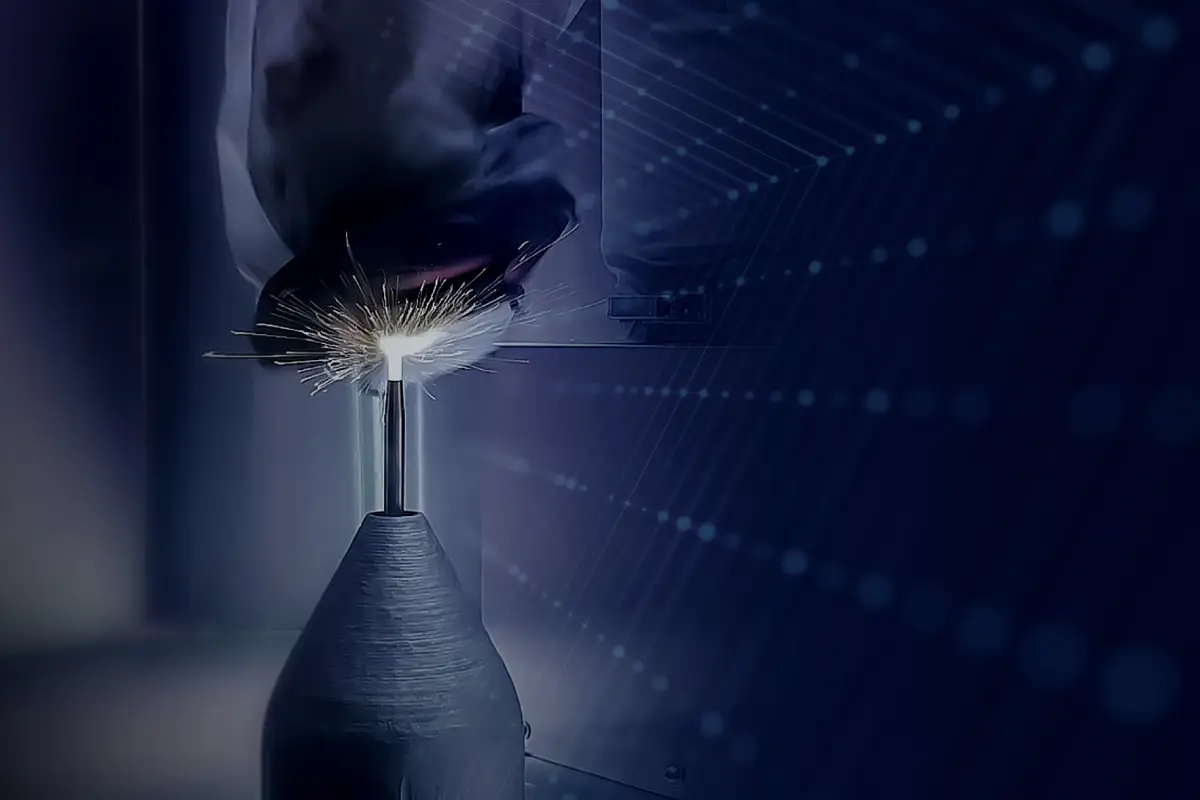 Close-up of an additive manufacturing process creating a metal nozzle, with bright sparks at the build point against a blue technology-themed background.