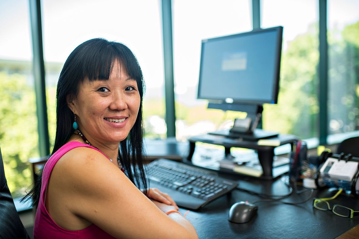 Person working at a workstation in an office environment.