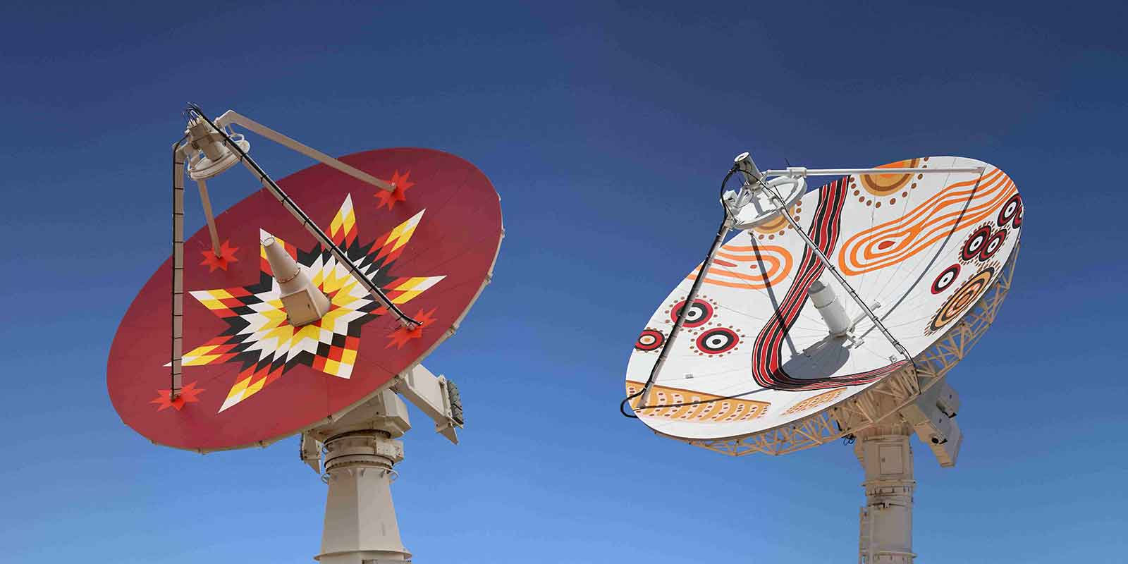 Satellite dishes painted in Aboriginal designs