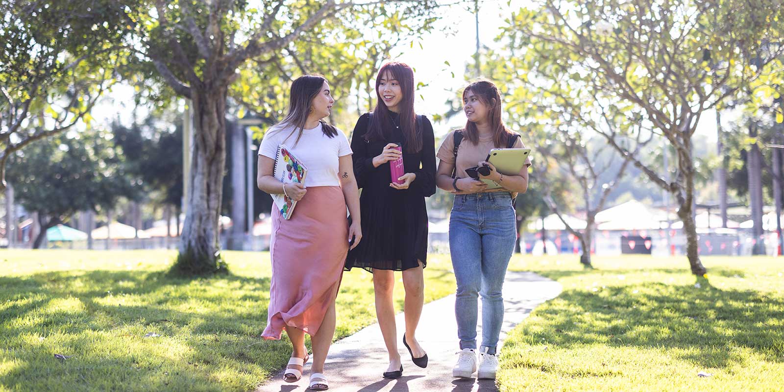 Students walking through park