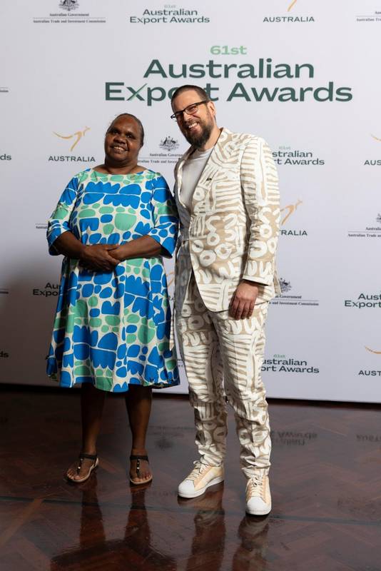 Two people smiling at the Australian Export Awards event.